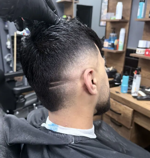A fade with a shaved part design